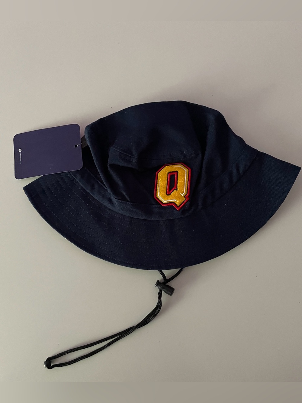 Queen’s University Navy Bucket Hat with Yellow Q Patch